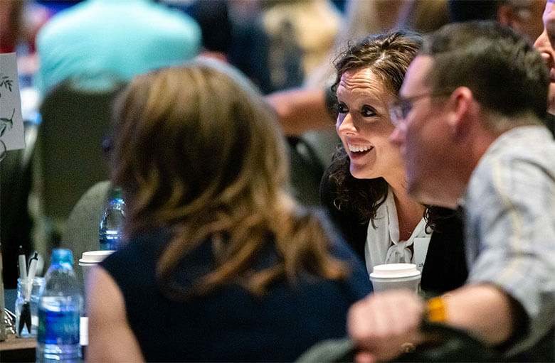 Conference attendees listening to Ron Deal.